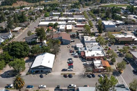 an aerial view of residential house with parking