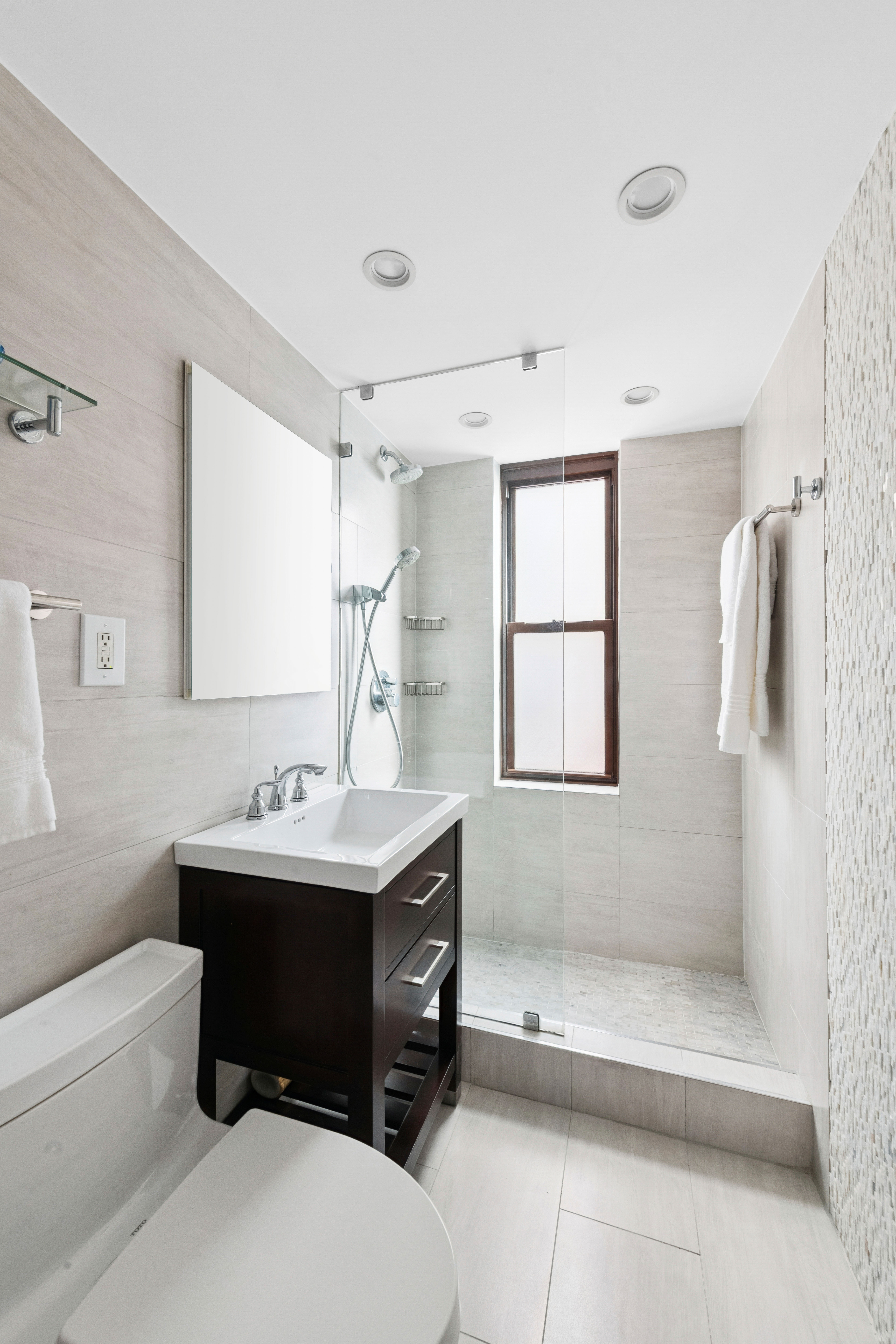 305 East 40th Street, Unit 19CD Manhattan, NY 10016 - Photo 13 of 16 a bathroom with a sink toilet tub and shower
