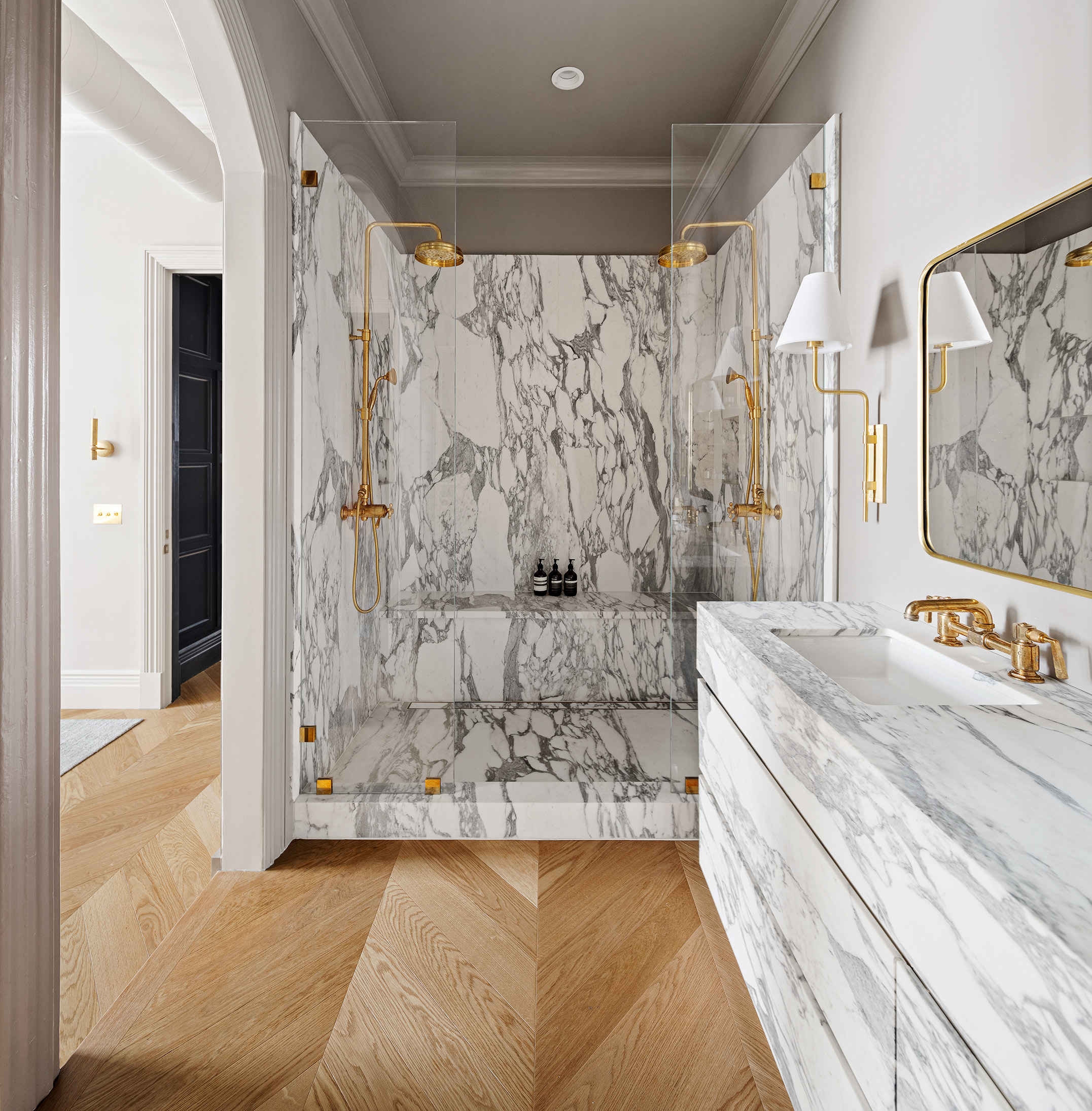35 Mercer Street, Unit 3E Manhattan, NY 10013 - Photo 15 of 21 a bathroom with a granite countertop sink a mirror a shower and bathtub