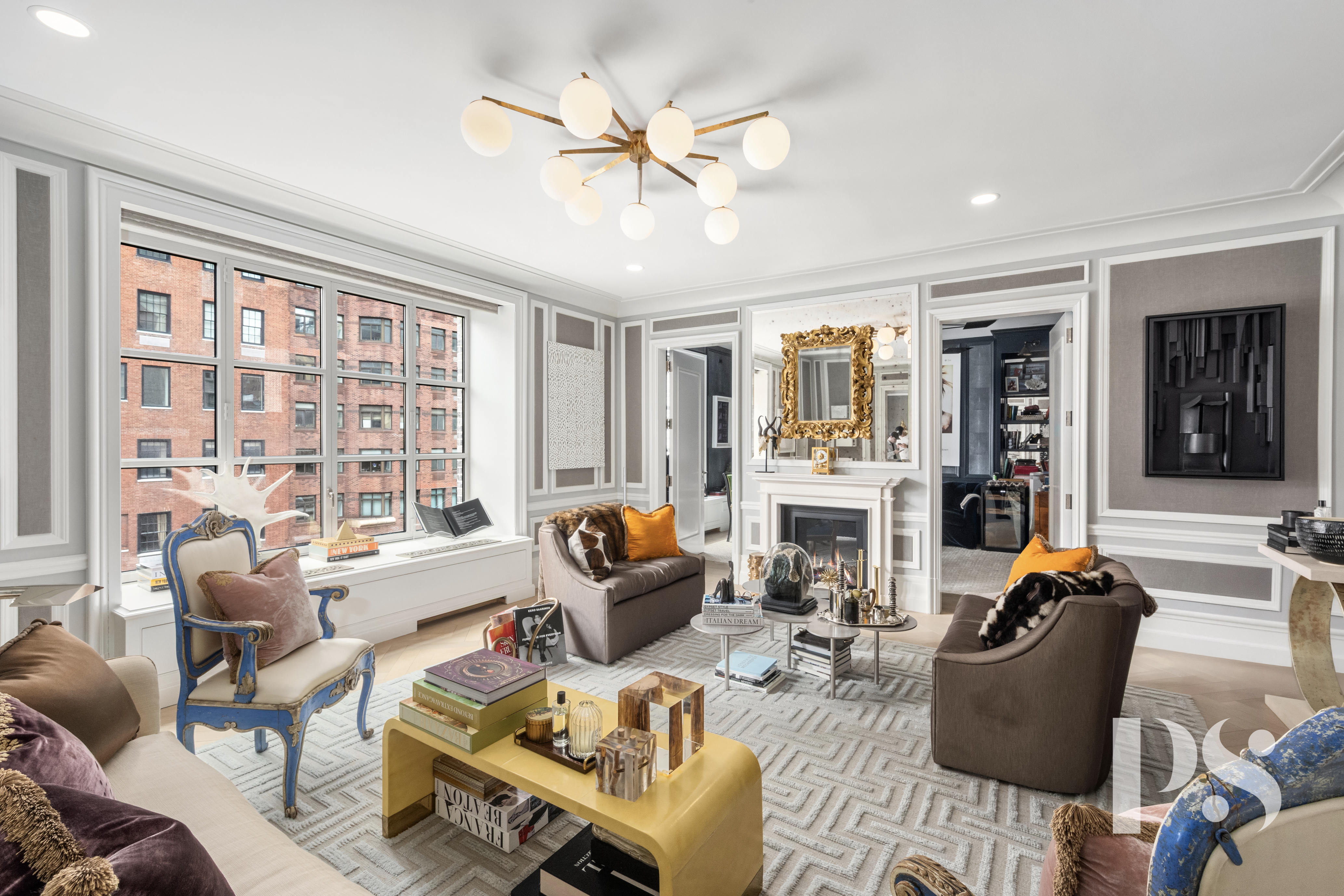 135 East 79th Street, Unit 8E Manhattan, NY 10075 - Photo 3 of 26 a living room with furniture fireplace and a large window