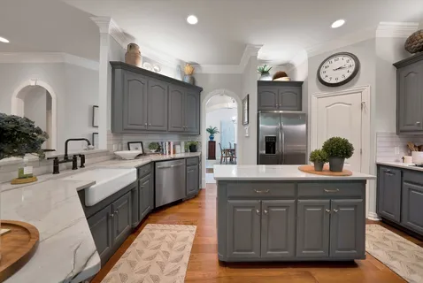 a kitchen with a sink cabinets and stainless steel appliances