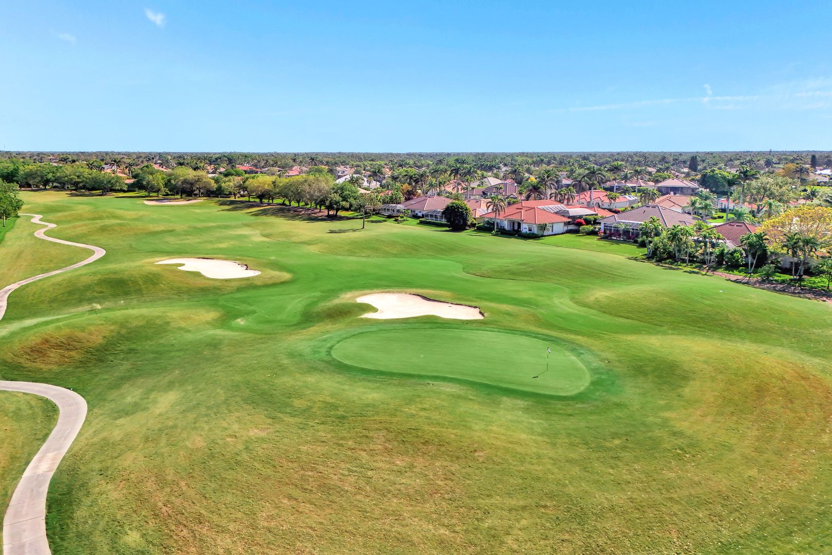 8228 Twelve Oaks Circle, Unit 323 Naples, FL 34113 - Photo 24 of 26 a view of a big yard with a large trees