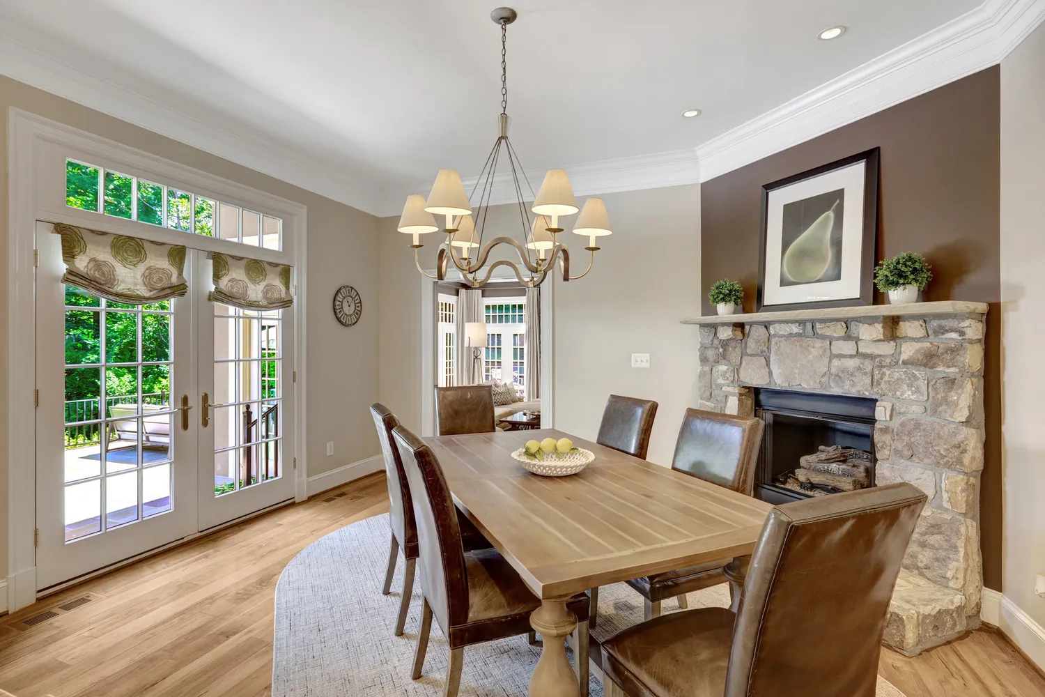 a bathroom with a granite countertop sink a toilet a large mirror and shower