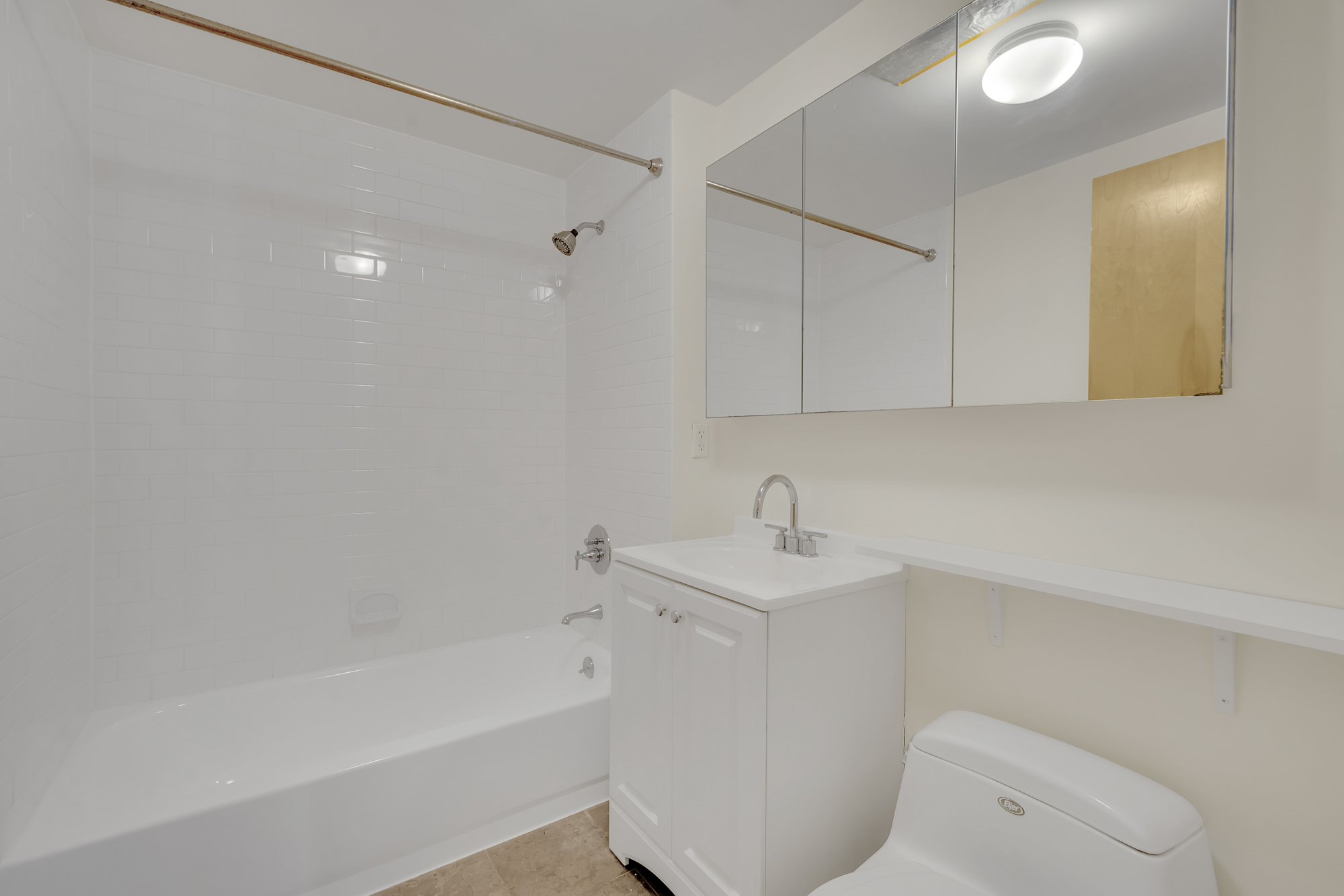 736 West 187th Street, Unit 502 Manhattan, NY 10033 - Photo 8 of 11 a bathroom with a sink a toilet and bathtub