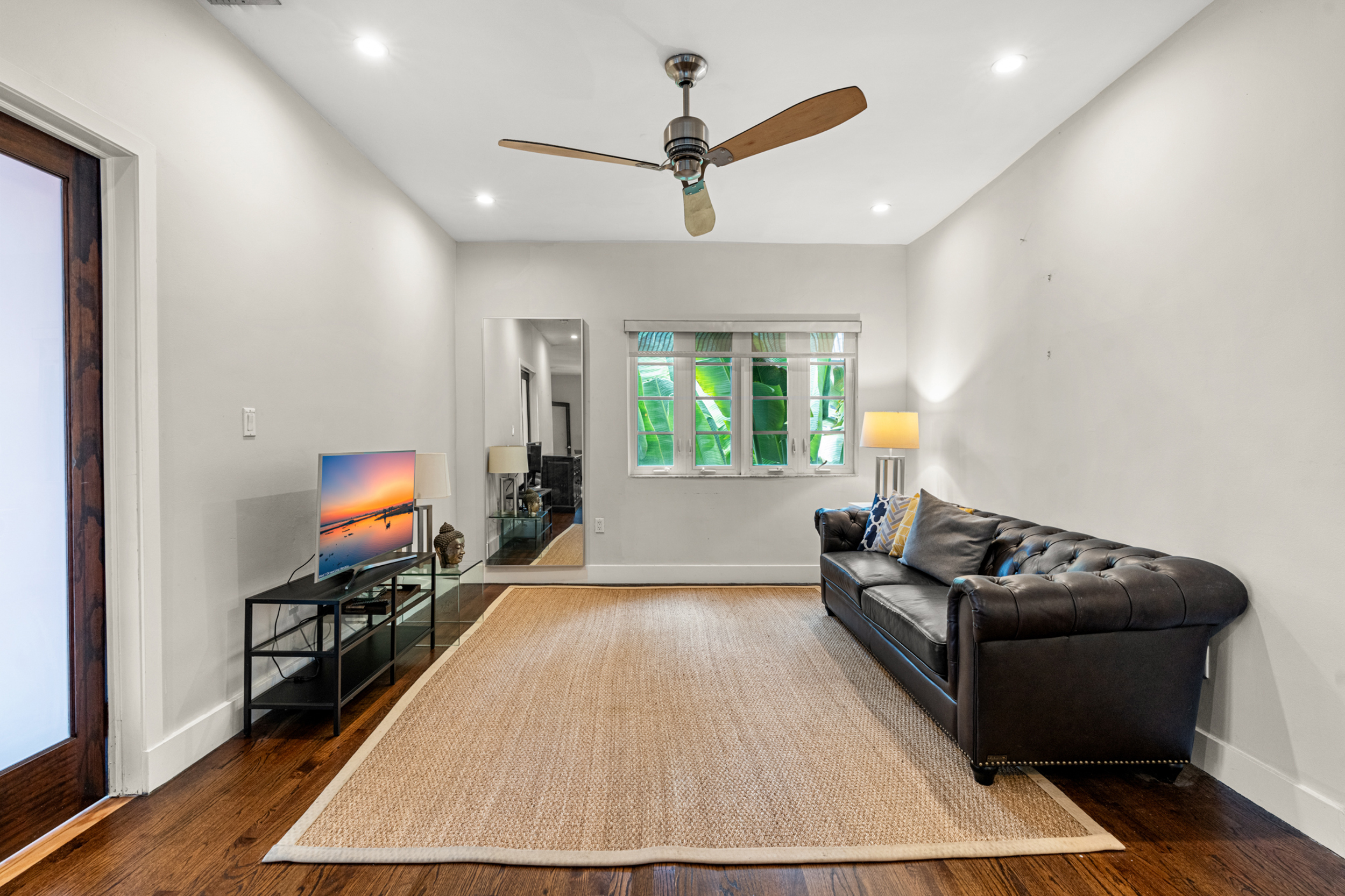 711 East 14th Street, Unit 7 Hialeah, FL 33010 - Photo 12 of 36 a living room with furniture and a flat screen tv