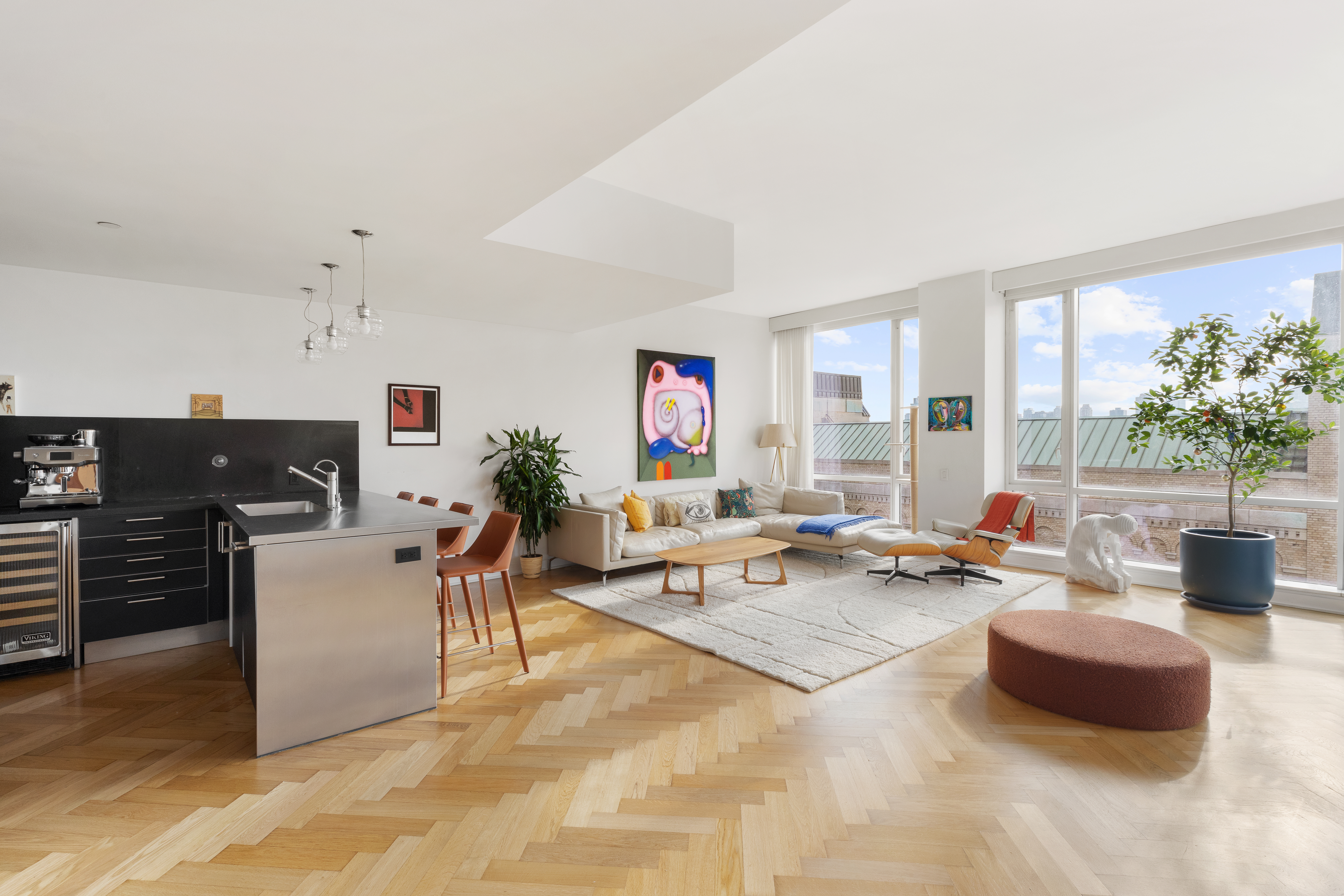 330 Spring Street, Unit 11B Manhattan, NY 10013 - Photo 1 of 10 a living room with furniture and a flat screen tv