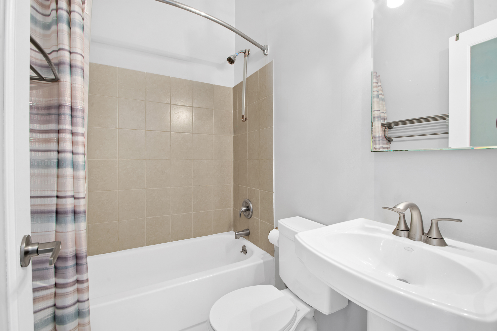 102 West 80th Street, Unit 87 Manhattan, NY 10024 - Photo 6 of 10 a bathroom with a sink toilet and shower