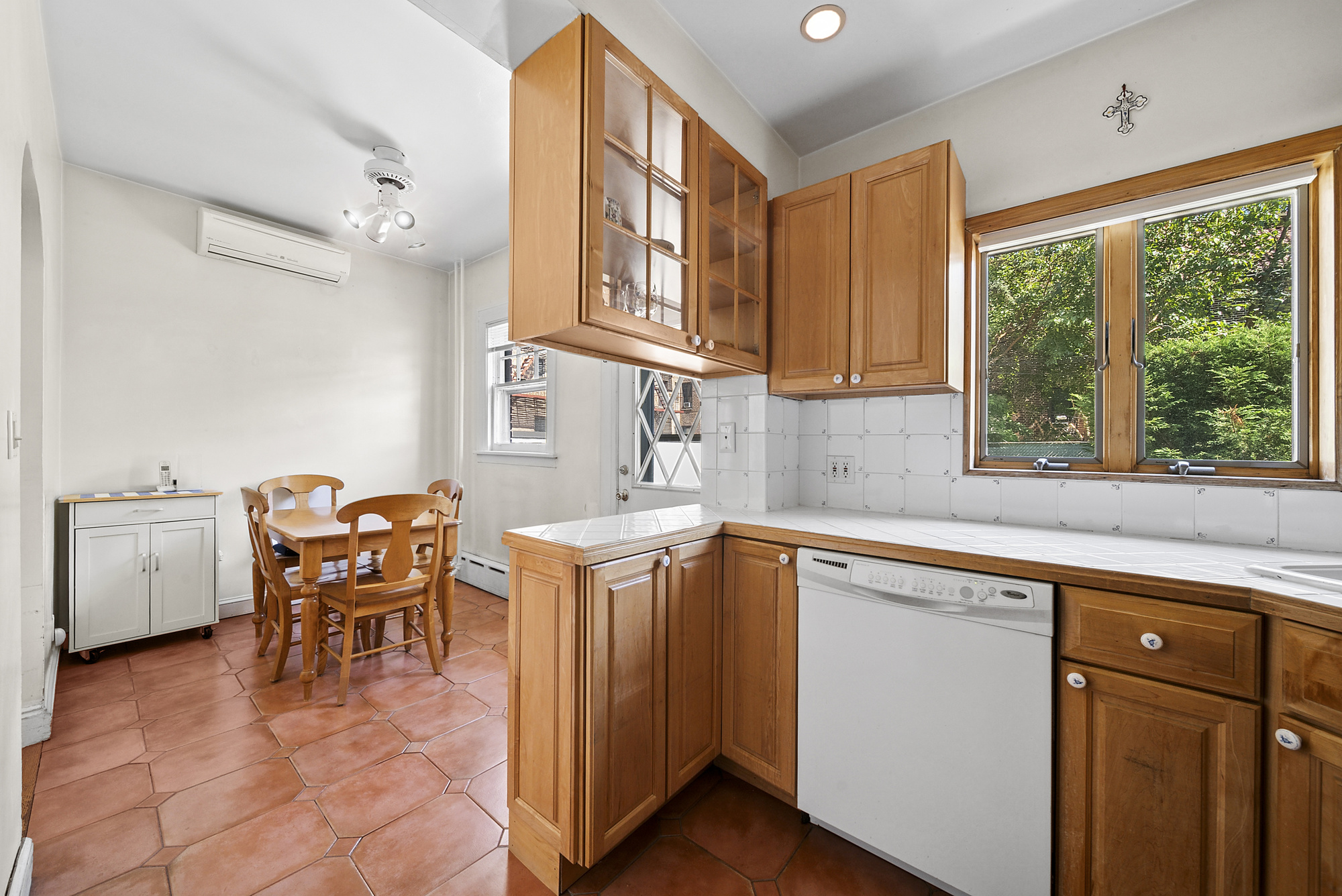 34-15 88th Street Queens, NY 11372 - Photo 7 of 15 a dining hall with stainless steel appliances granite countertop a stove and a sink