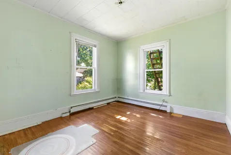 a view of an empty room with a window