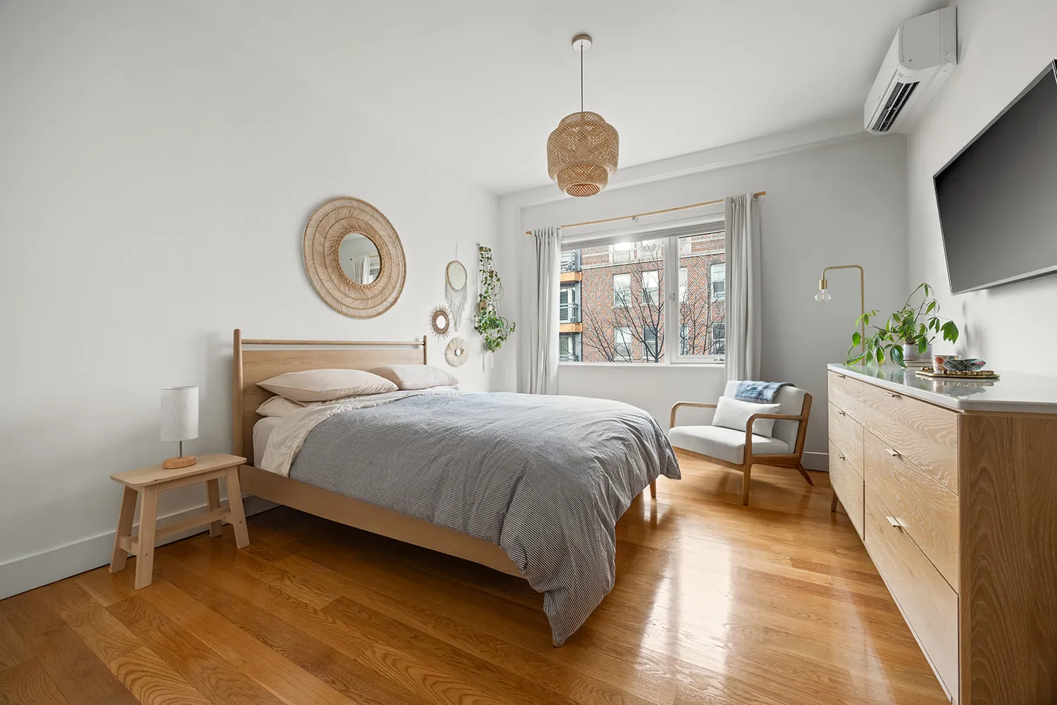 a bedroom with a large bed and a large window