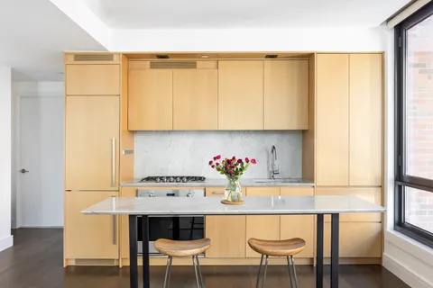 a dining room with furniture and a window