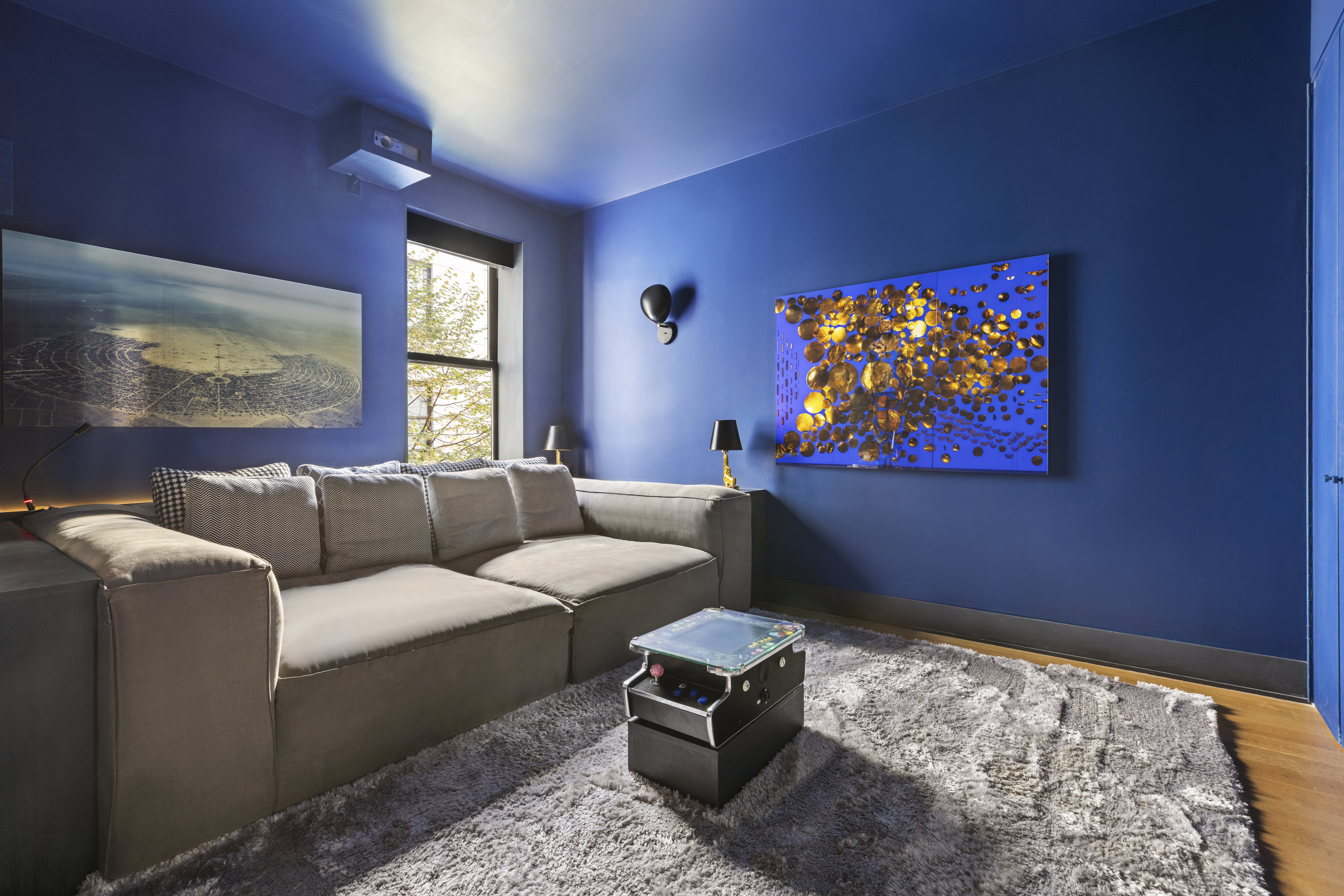 71 Reade Street, Unit 5A Manhattan, NY 10007 - Photo 18 of 27 a living room with furniture a couch and a flat screen tv