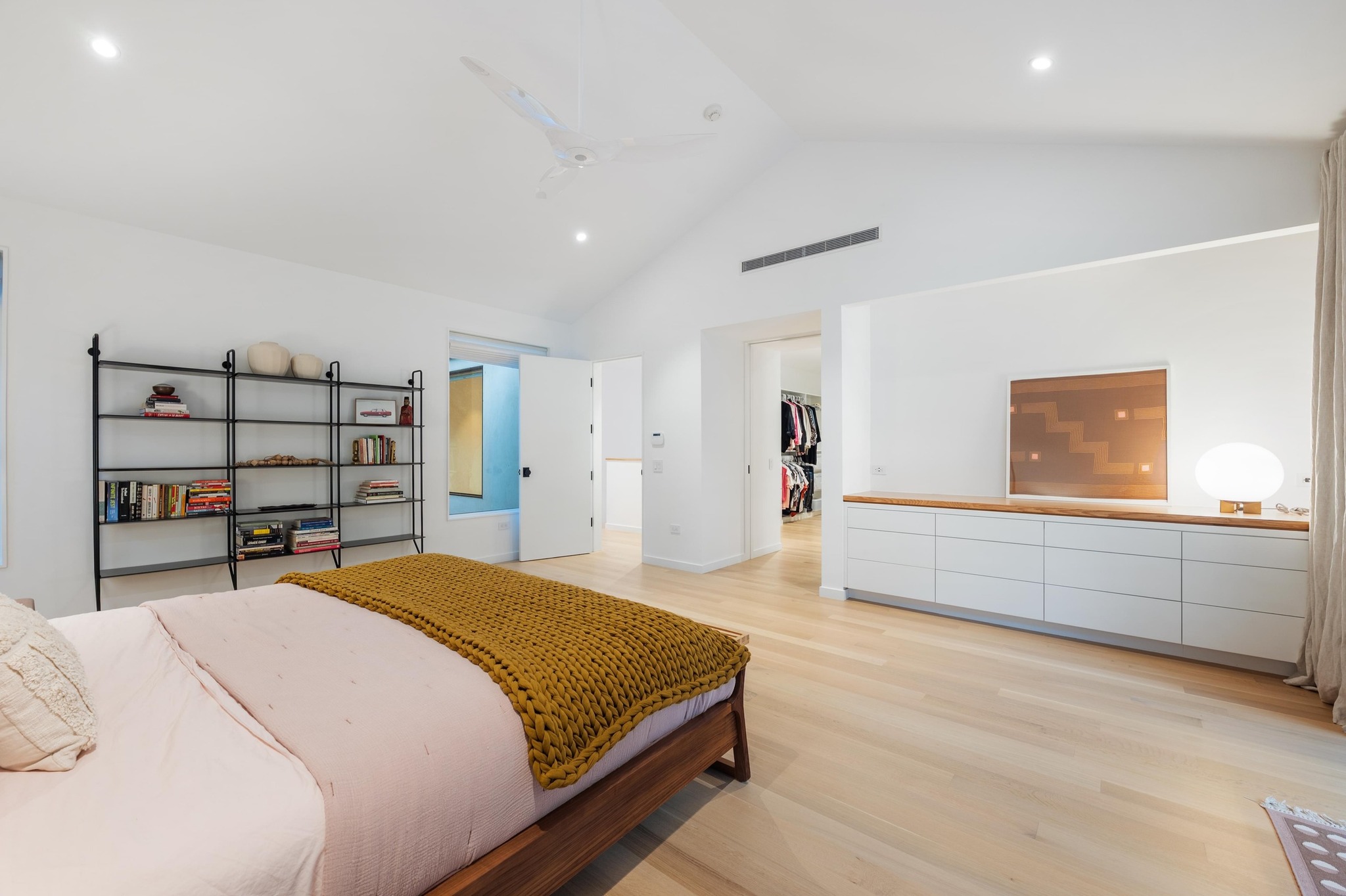 1206 Bickler Road Austin, TX 78704 - Photo 36 of 65 a bedroom with a bed and a cabinets