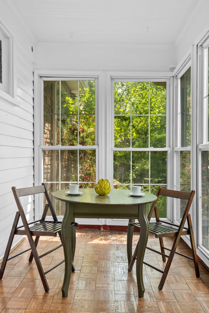 685 East 22nd Street Brooklyn, NY 11210 - Photo 32 of 43 a table and chairs in a room next to a window
