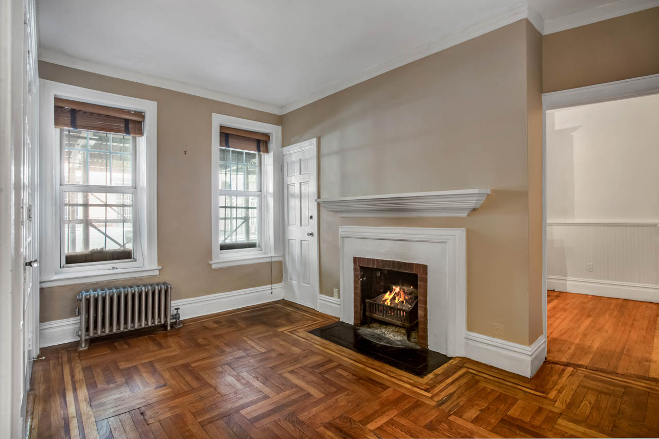 344 West 12th Street, Unit 1A Manhattan, NY 10014 - Photo 3 of 17 a view of an empty room with window and fire place