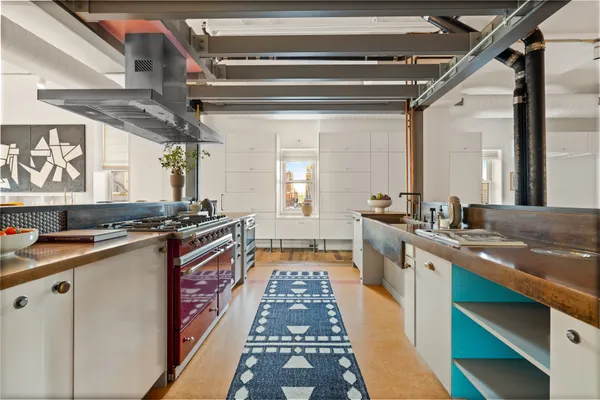 a large kitchen with stainless steel appliances granite countertop lots of counter top space