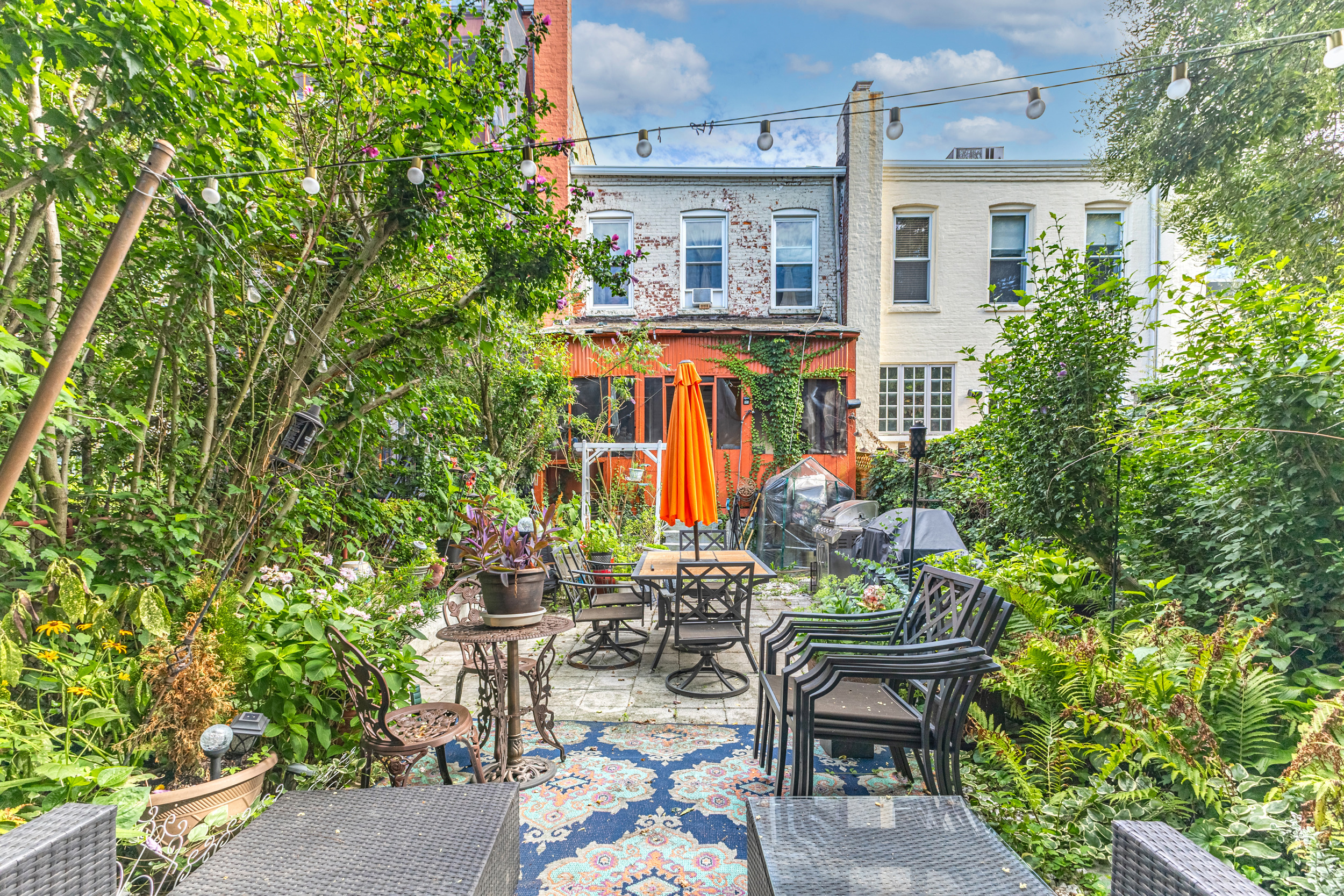 201 Maple Street Brooklyn, NY 11225 - Photo 19 of 21 a view of a patio with table and chairs and potted plants