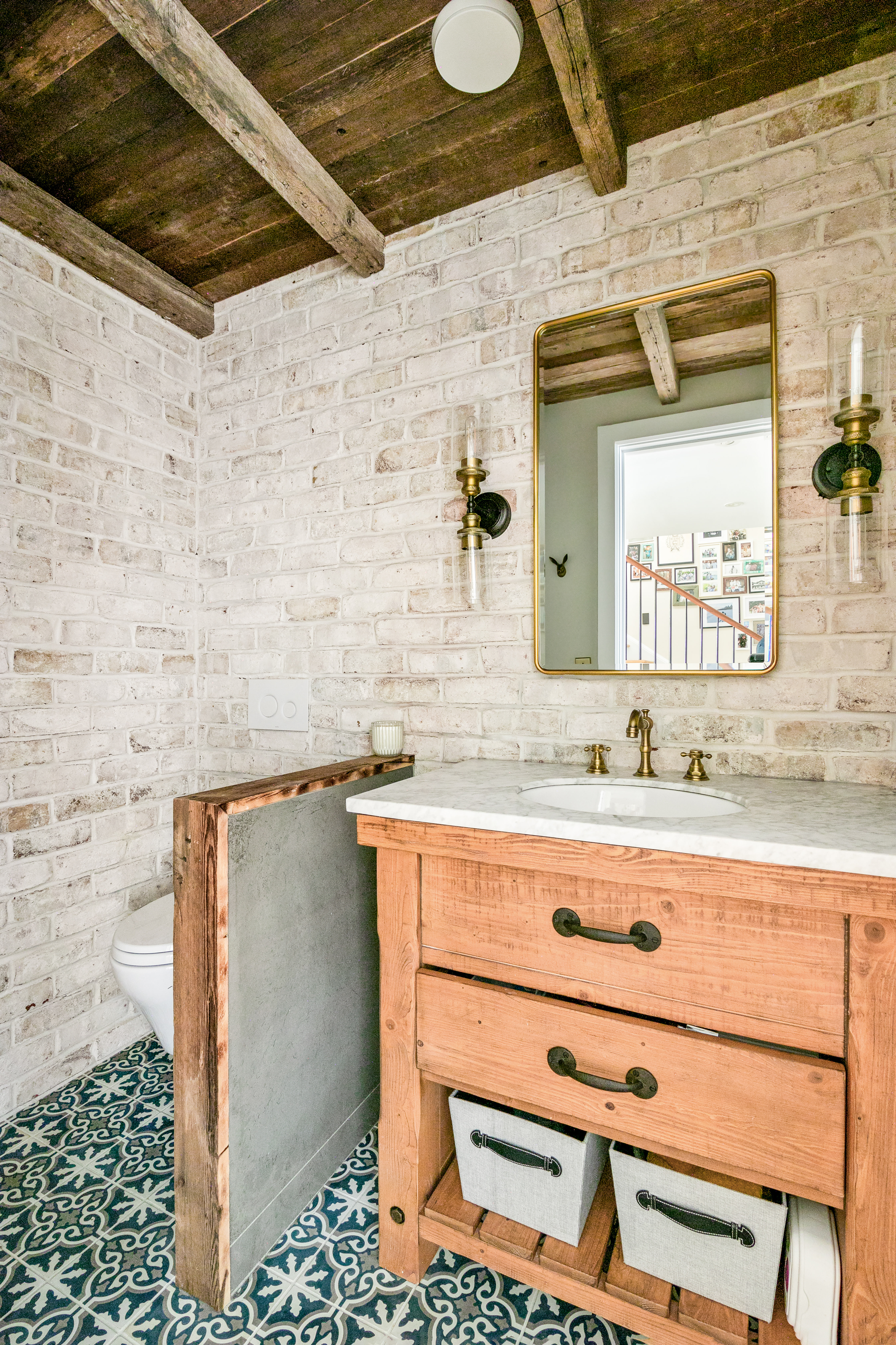 152 West 13th Street Manhattan, NY 10011 - Photo 5 of 28 a bathroom with a sink and a mirror