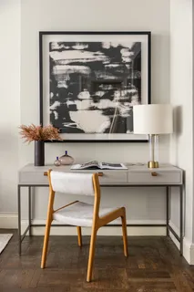 a room with a table and chairs