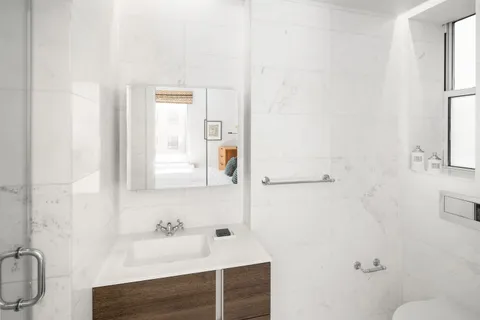 a bedroom with bed and window