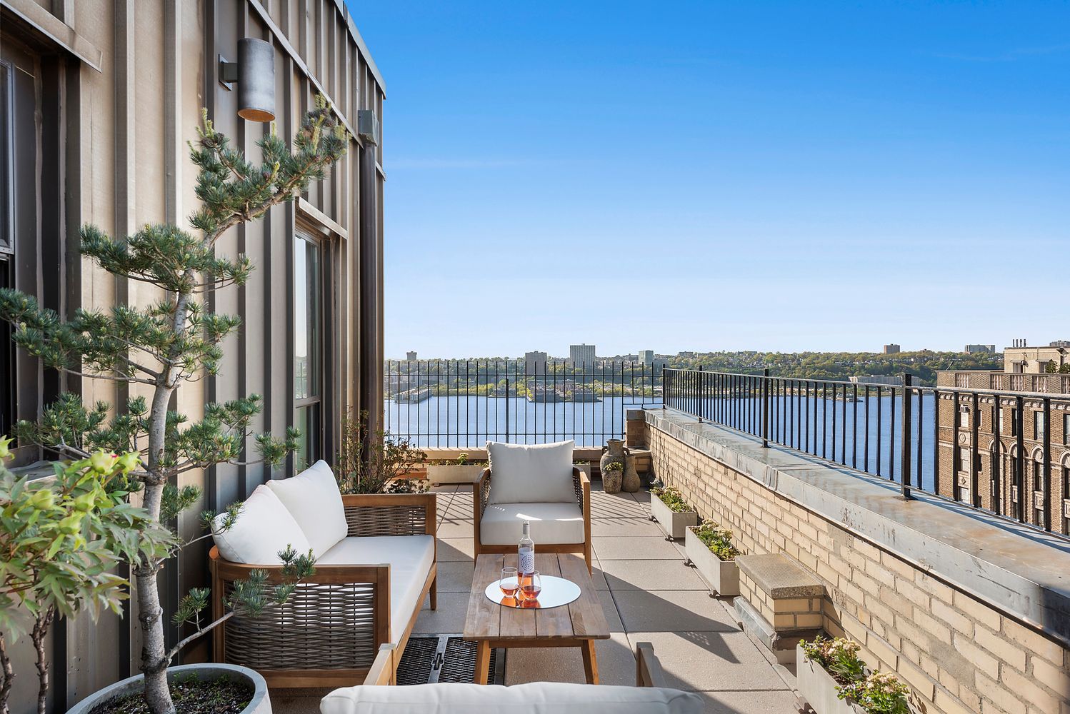 a view of balcony with couch and chairs