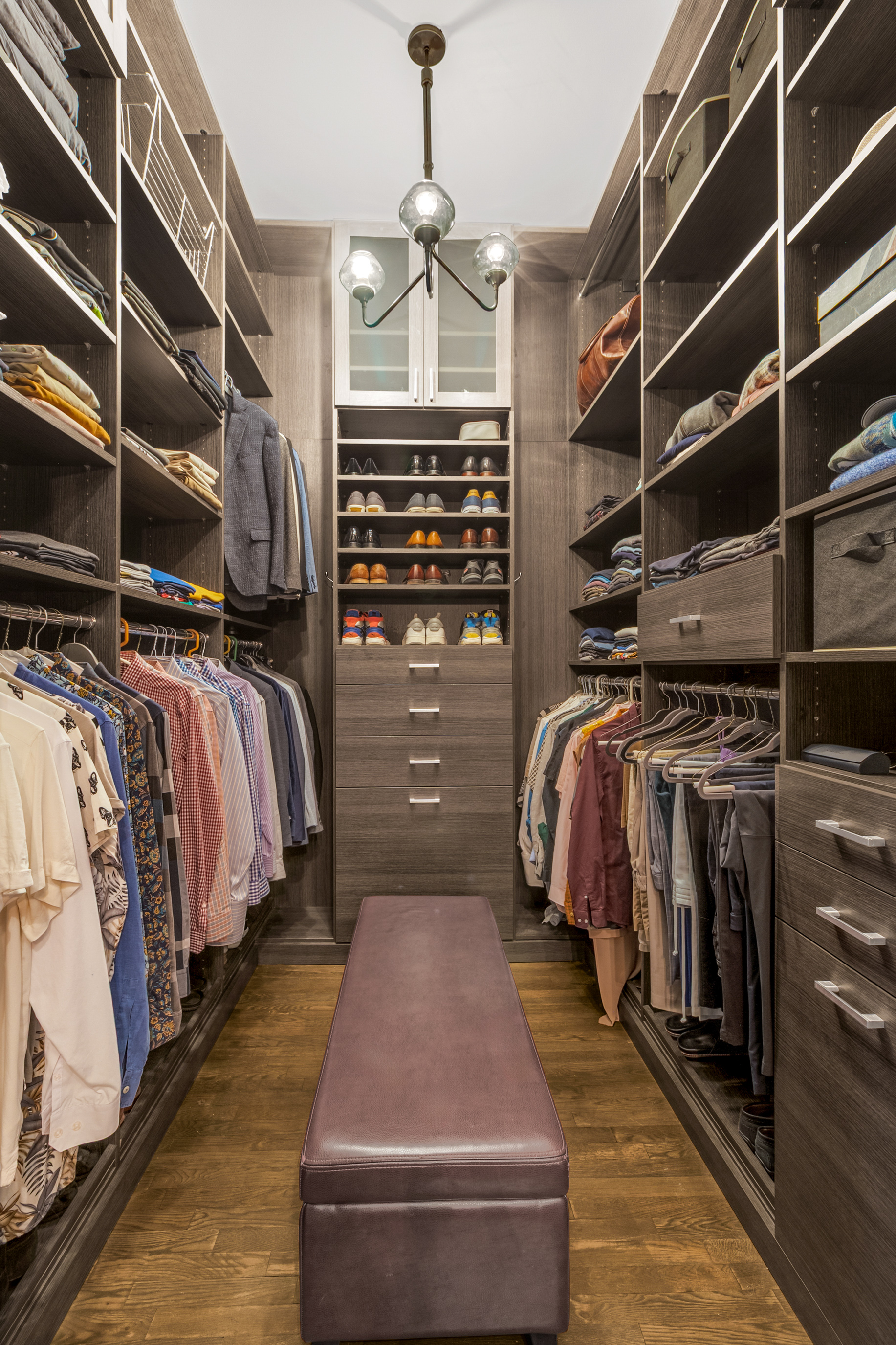 521 West 47th Street, Unit 3A Manhattan, NY 10036 - Photo 11 of 13 a view of walk in closet with clothes and shoes