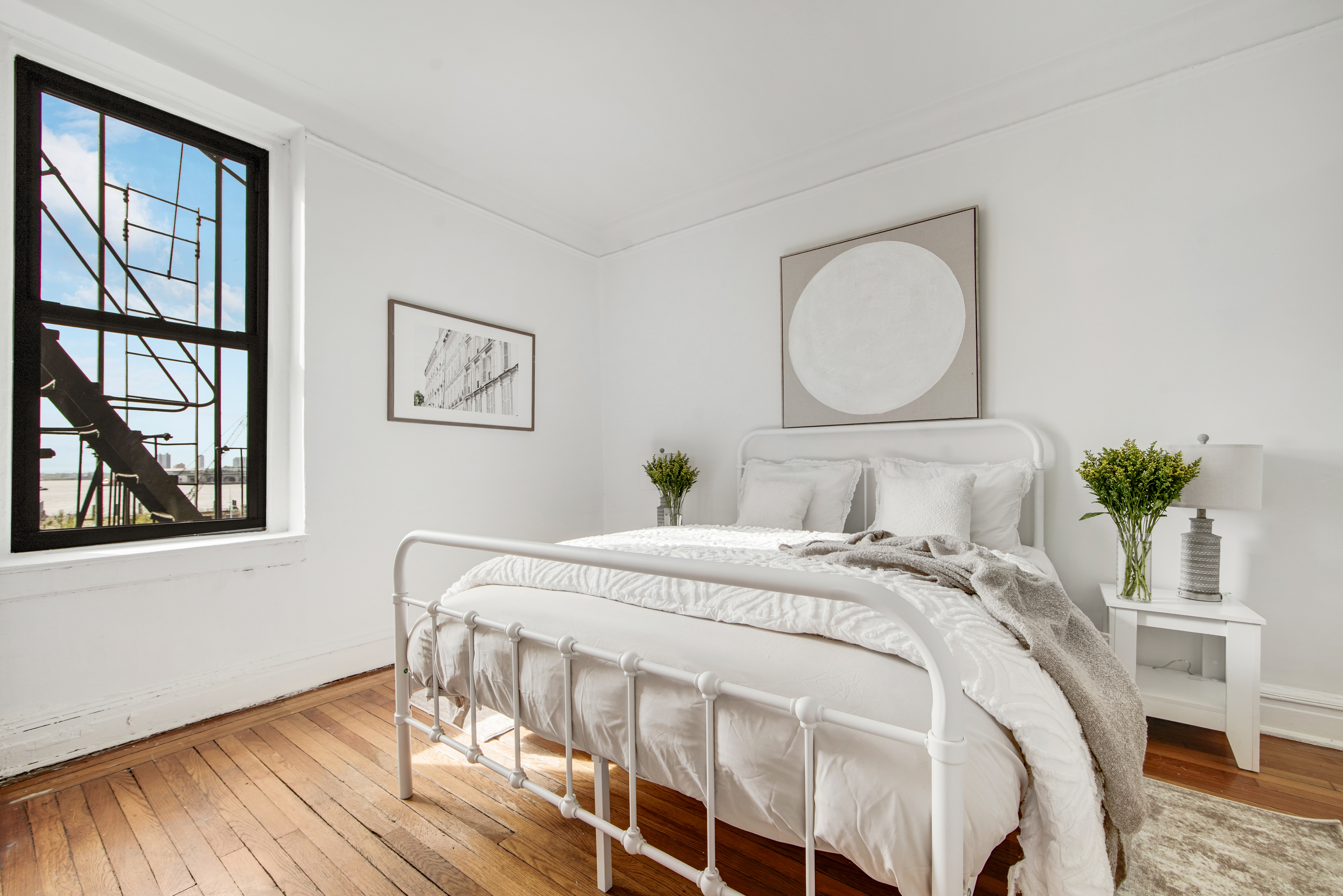 2 Grace Court, Unit 1X Brooklyn, NY 11201 - Photo 6 of 12 a bedroom with a bed and wooden floor