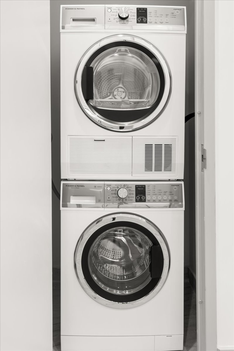 463 West 142nd Street, Unit 4B Manhattan, NY 10031 - Photo 7 of 10 a close up view of a washer and dryer