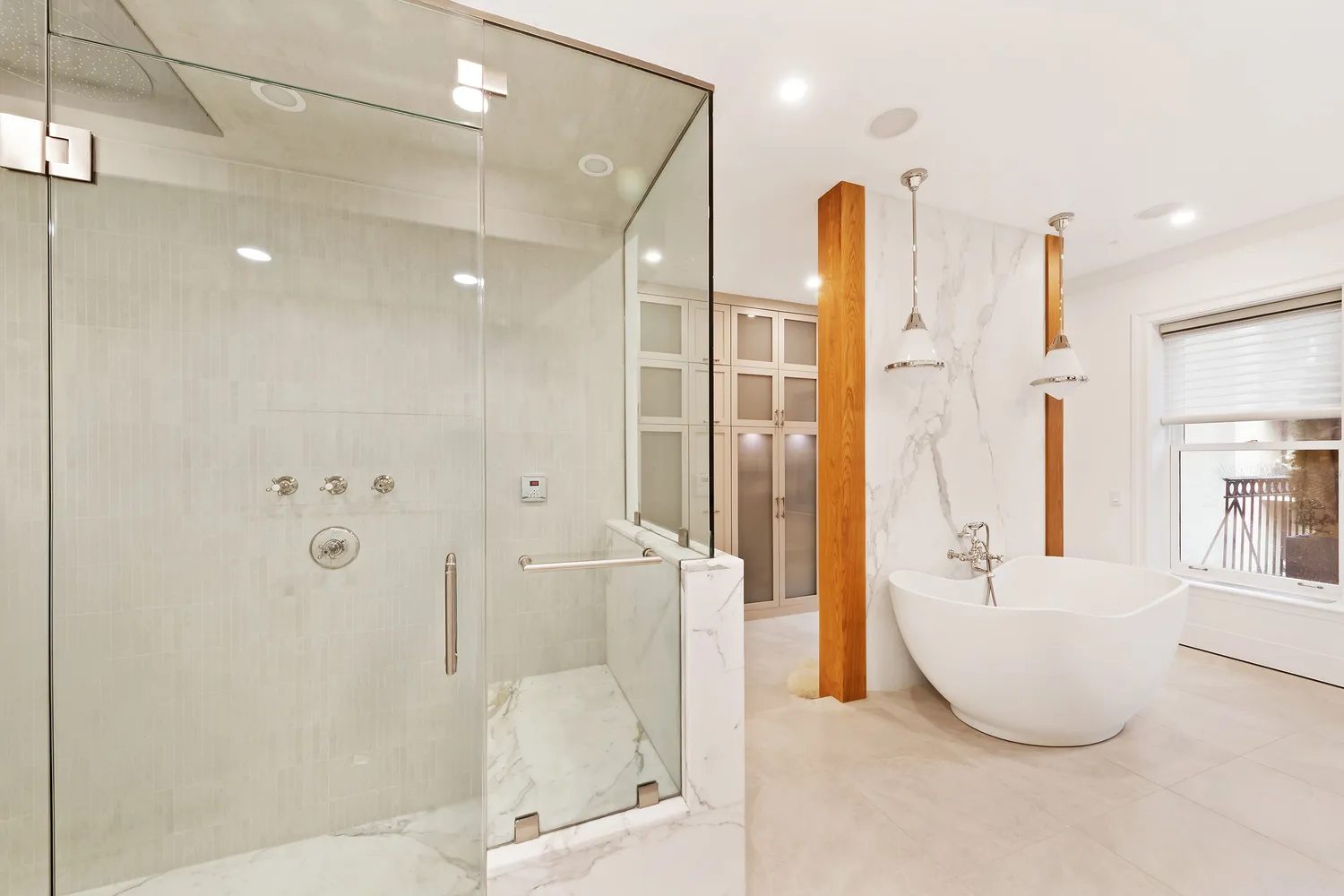 a bathroom with a tub and shower