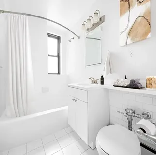 a bathroom with a sink a toilet and bathtub