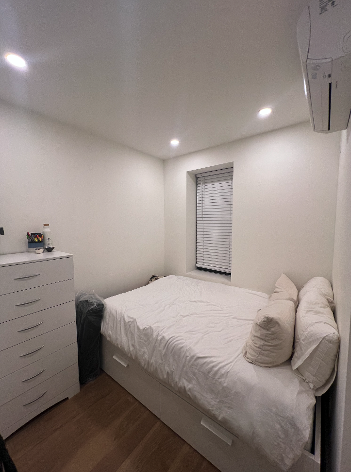 34 Carmine Street, Unit 2D Manhattan, NY 10014 - Photo 4 of 8 a bedroom with a bed and a dresser