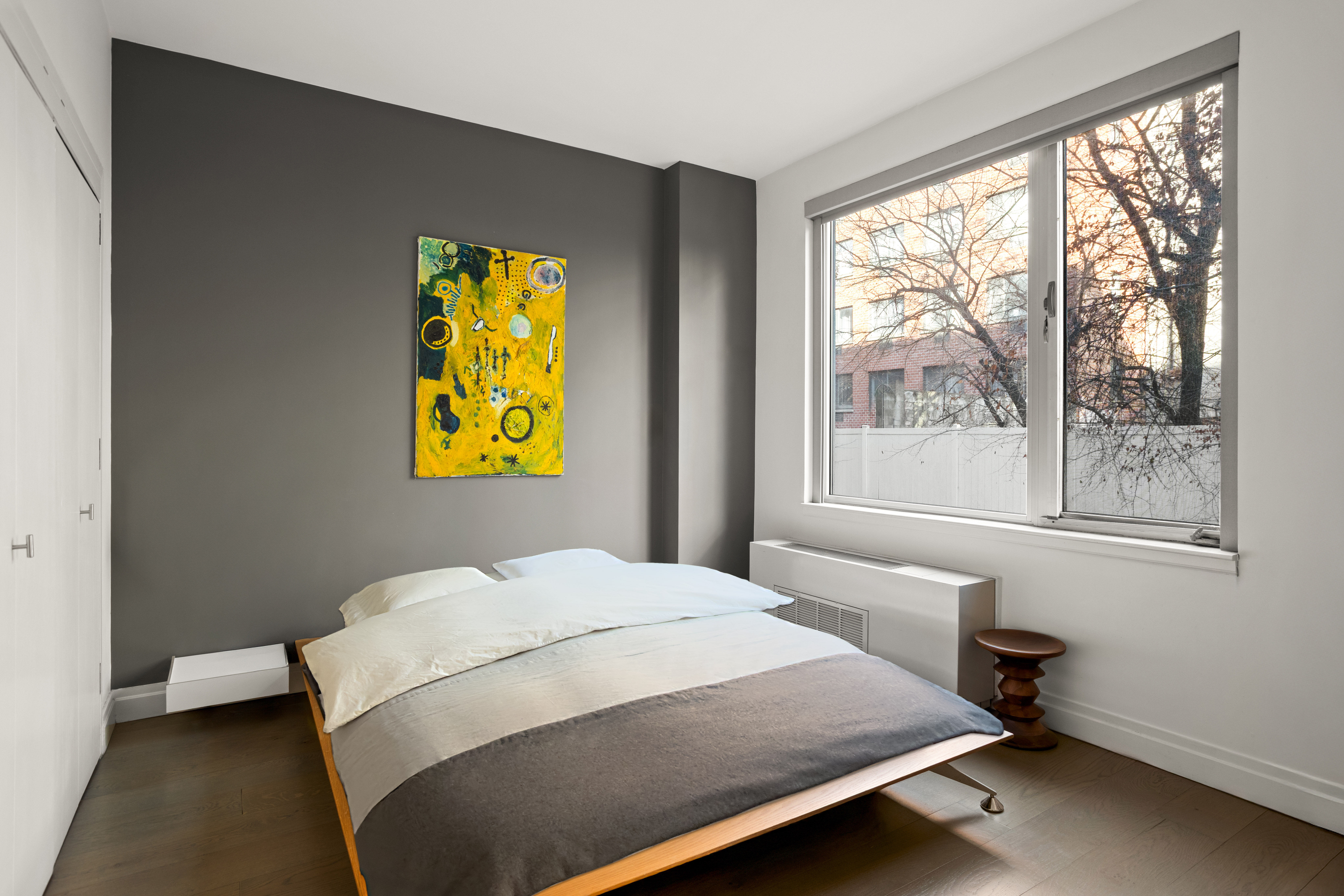 517 West 46th Street, Unit 205 Manhattan, NY 10036 - Photo 4 of 6 a bedroom with a bed and a window