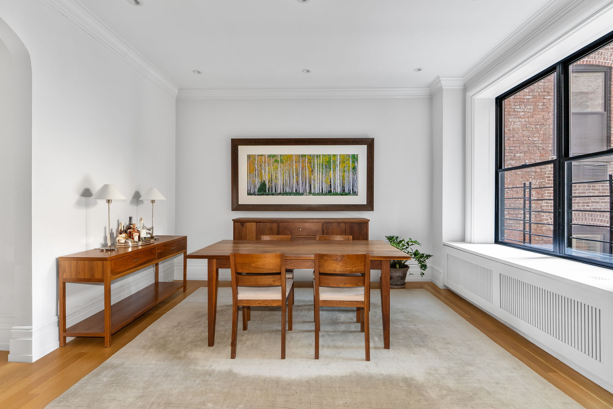 210 Riverside Drive, Unit 2E Manhattan, NY 10025 - Photo 4 of 15 a dining room with furniture and window