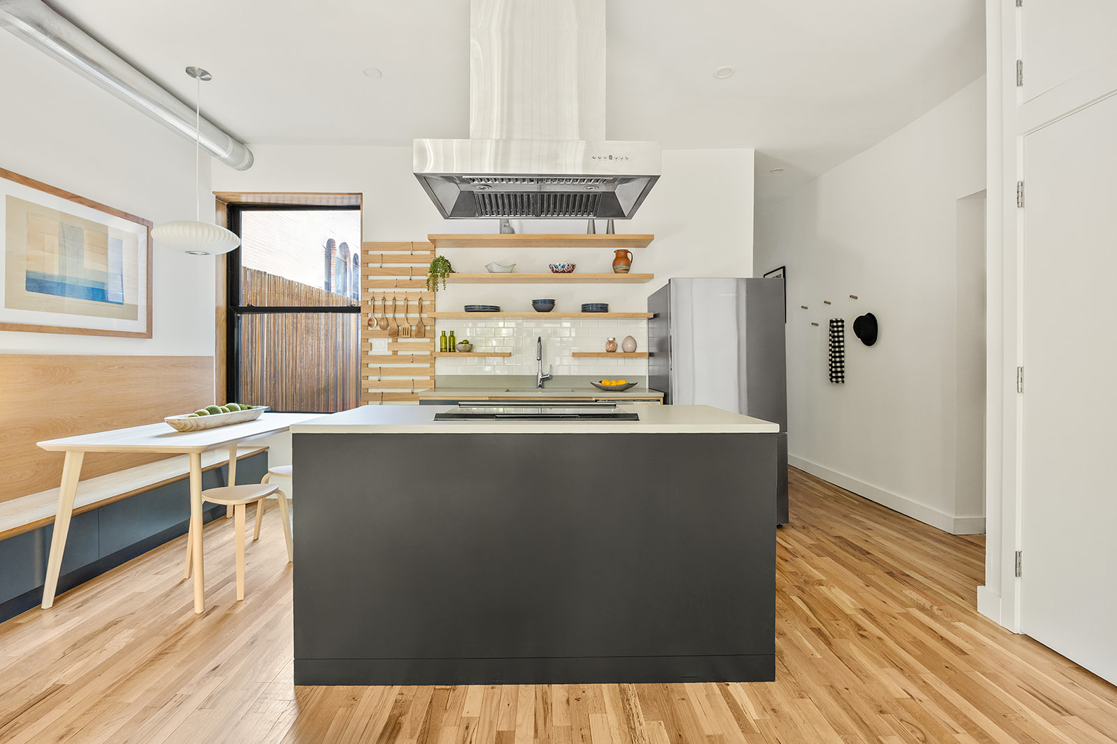 149 Clinton Avenue, Unit 1B Brooklyn, NY 11205 - Photo 4 of 9 a living room with stainless steel appliances wooden floor and a window