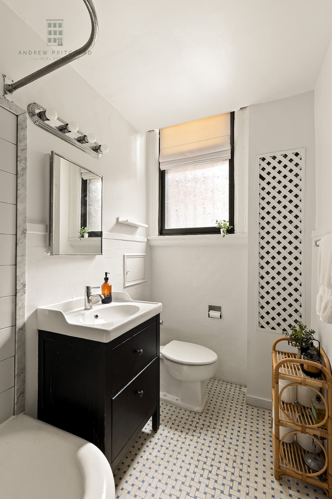 212 East 48th Street, Unit 1D Manhattan, NY 10017 - Photo 6 of 12 a bathroom with a sink toilet a mirror and shower
