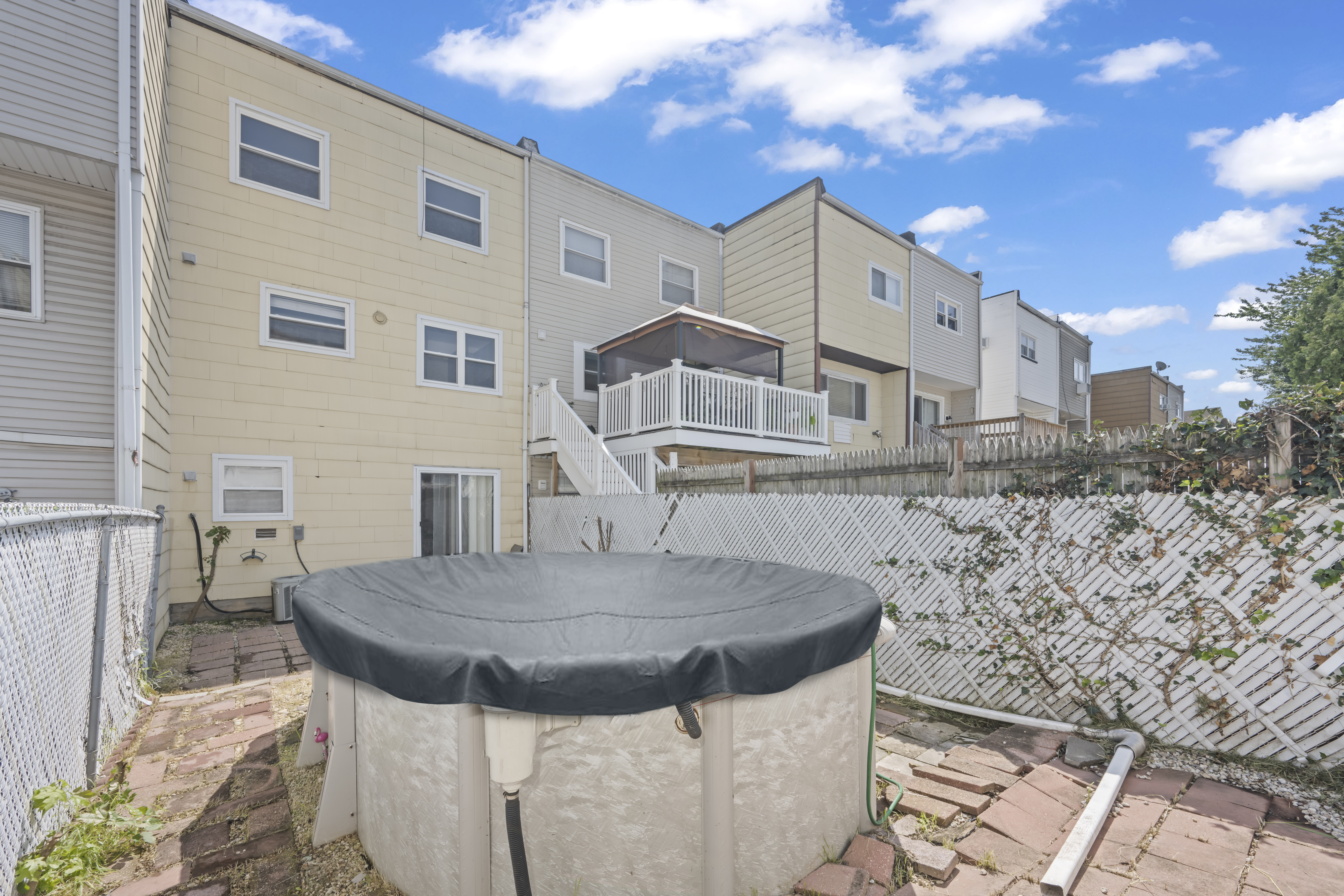 12 Yucca Drive Staten Island, NY 10312 - Photo 21 of 21 a view of dinning table and chairs in the patio