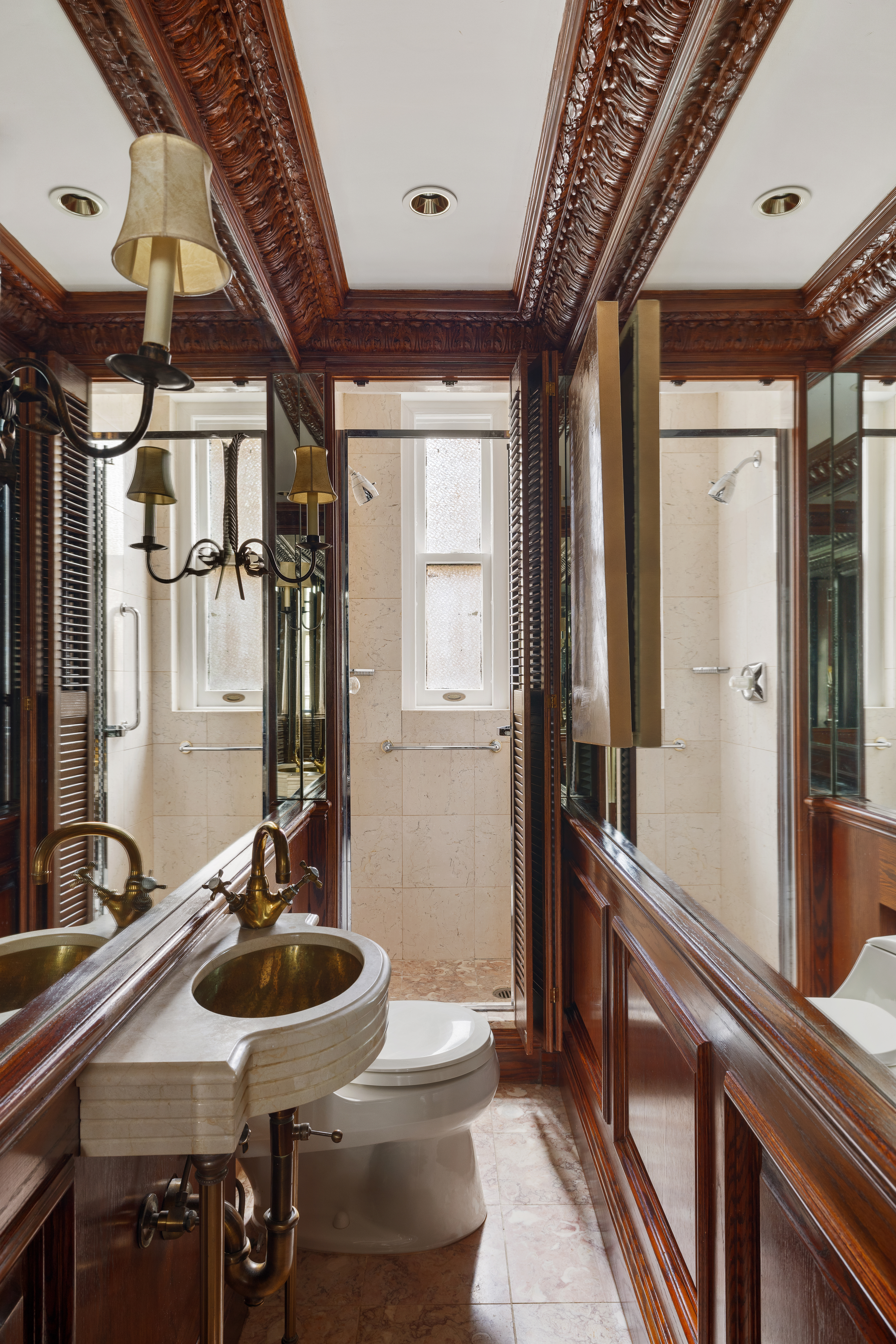14 East 75th Street, Unit 10C Manhattan, NY 10021 - Photo 8 of 16 a bathroom with sink and mirror