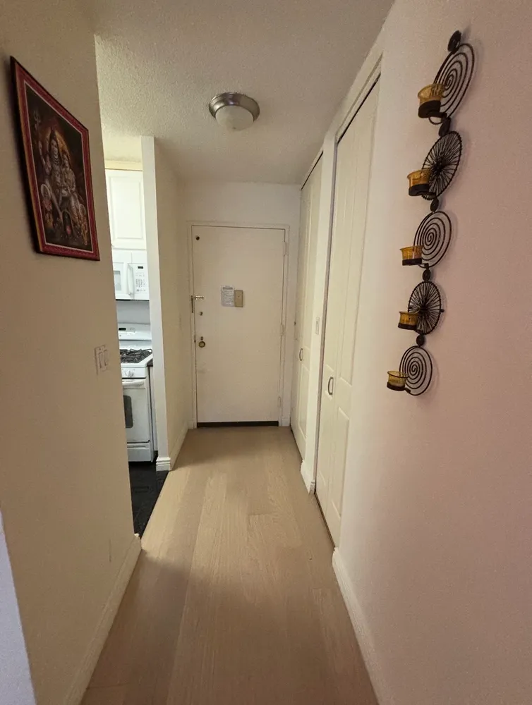 a view of a balcony with couch and door