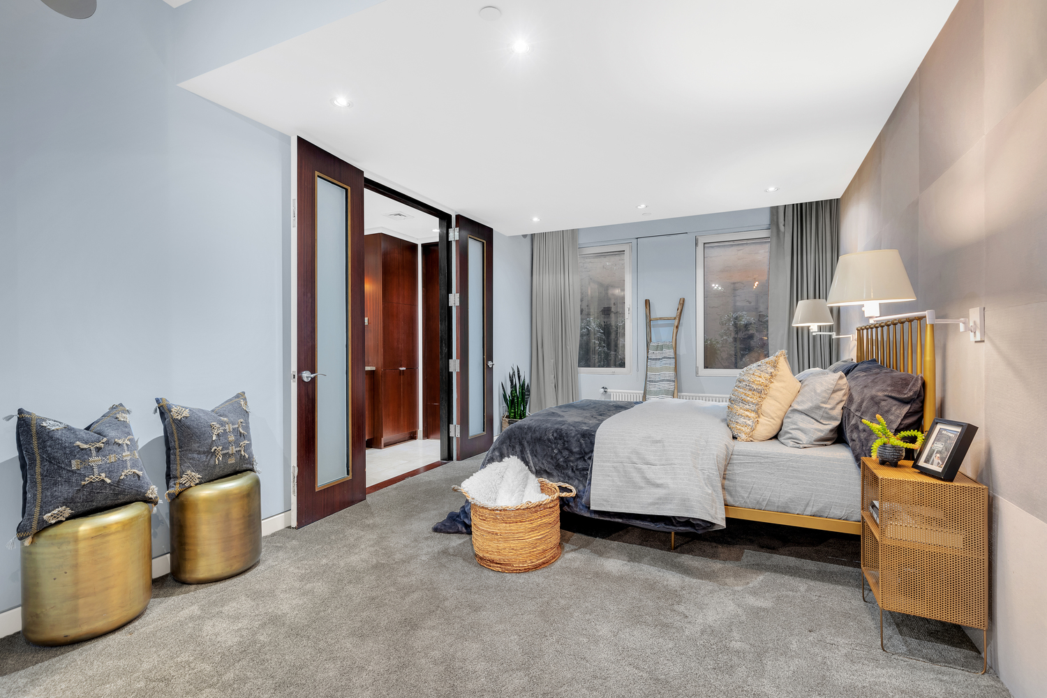 200 Mercer Street, Unit MAIS-G Manhattan, NY 10012 - Photo 9 of 17 a bedroom with furniture and a potted plant