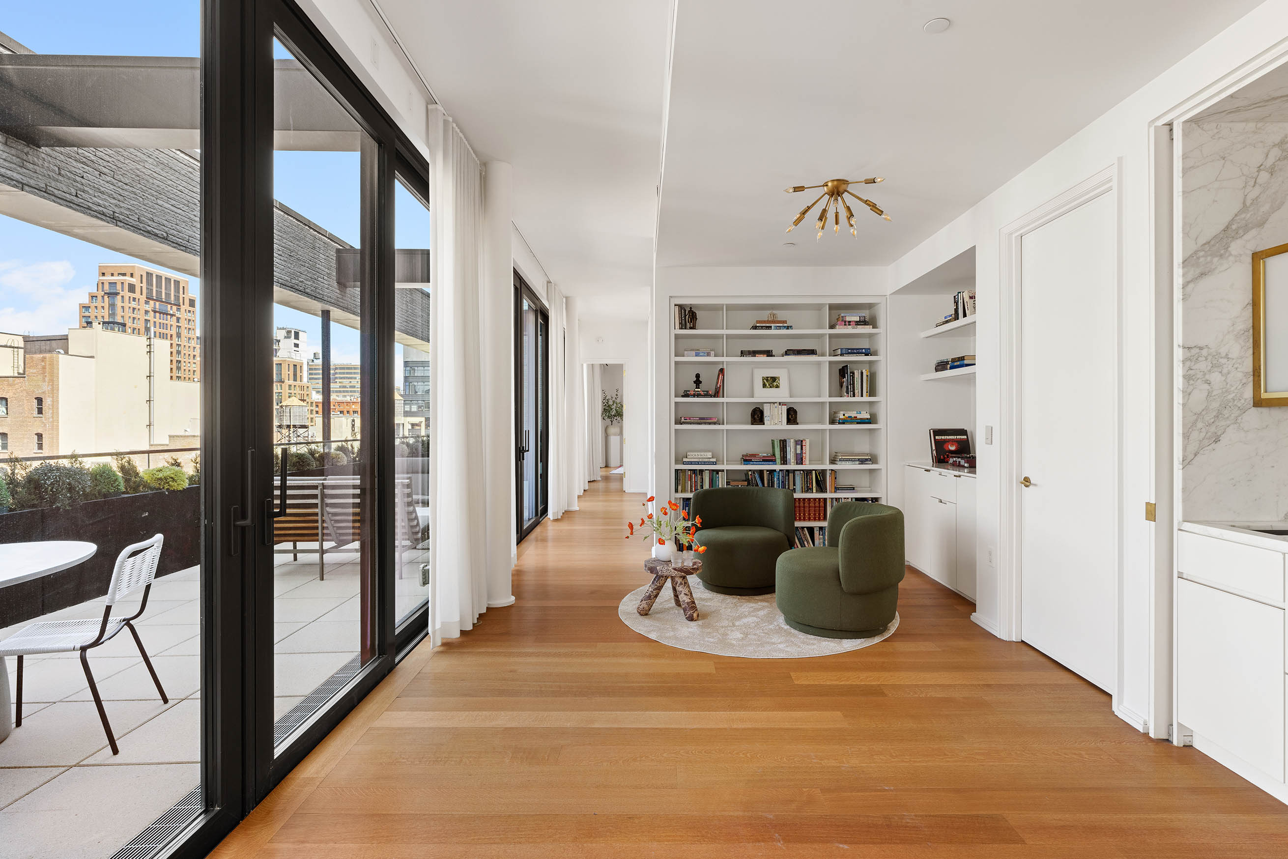 505 West 19th Street, Unit PH1 Manhattan, NY 10011 - Photo 6 of 26 a view of a living room and a window with furniture