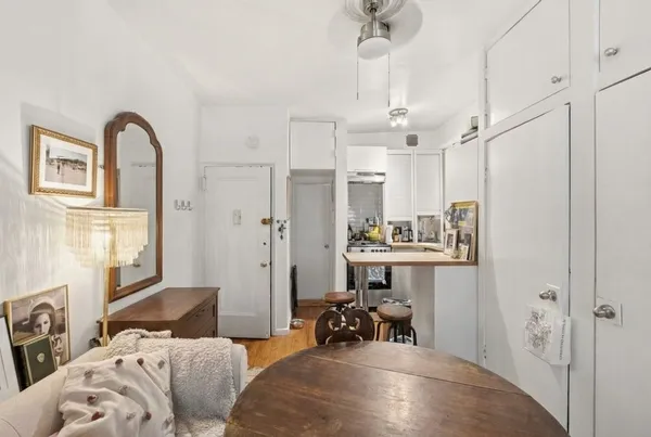 a bedroom with furniture and a chandelier