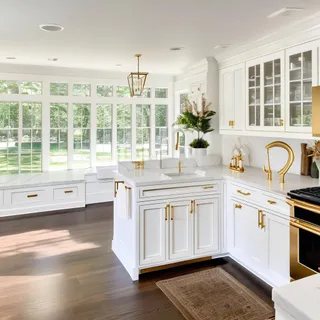 a kitchen with stainless steel appliances granite countertop a stove a sink and a granite counter tops with white cabinets