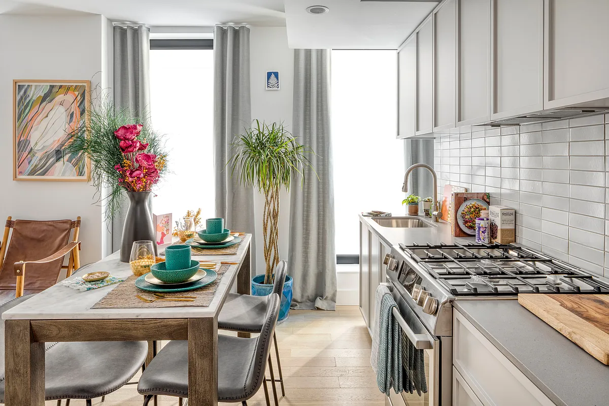 111 Montgomery Street, Unit 6D Brooklyn, NY 11225 - Photo 2 of 10 a kitchen with a table and chairs