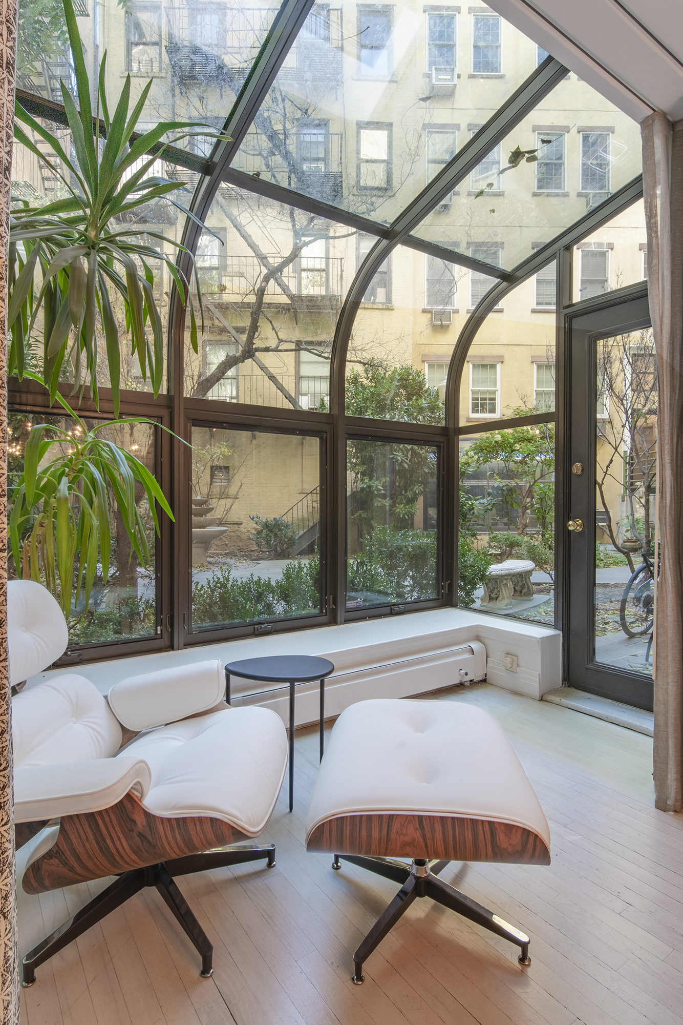 407 East 12th Street, Unit 1RSE Manhattan, NY 10009 - Photo 7 of 13 a room with furniture and a large window