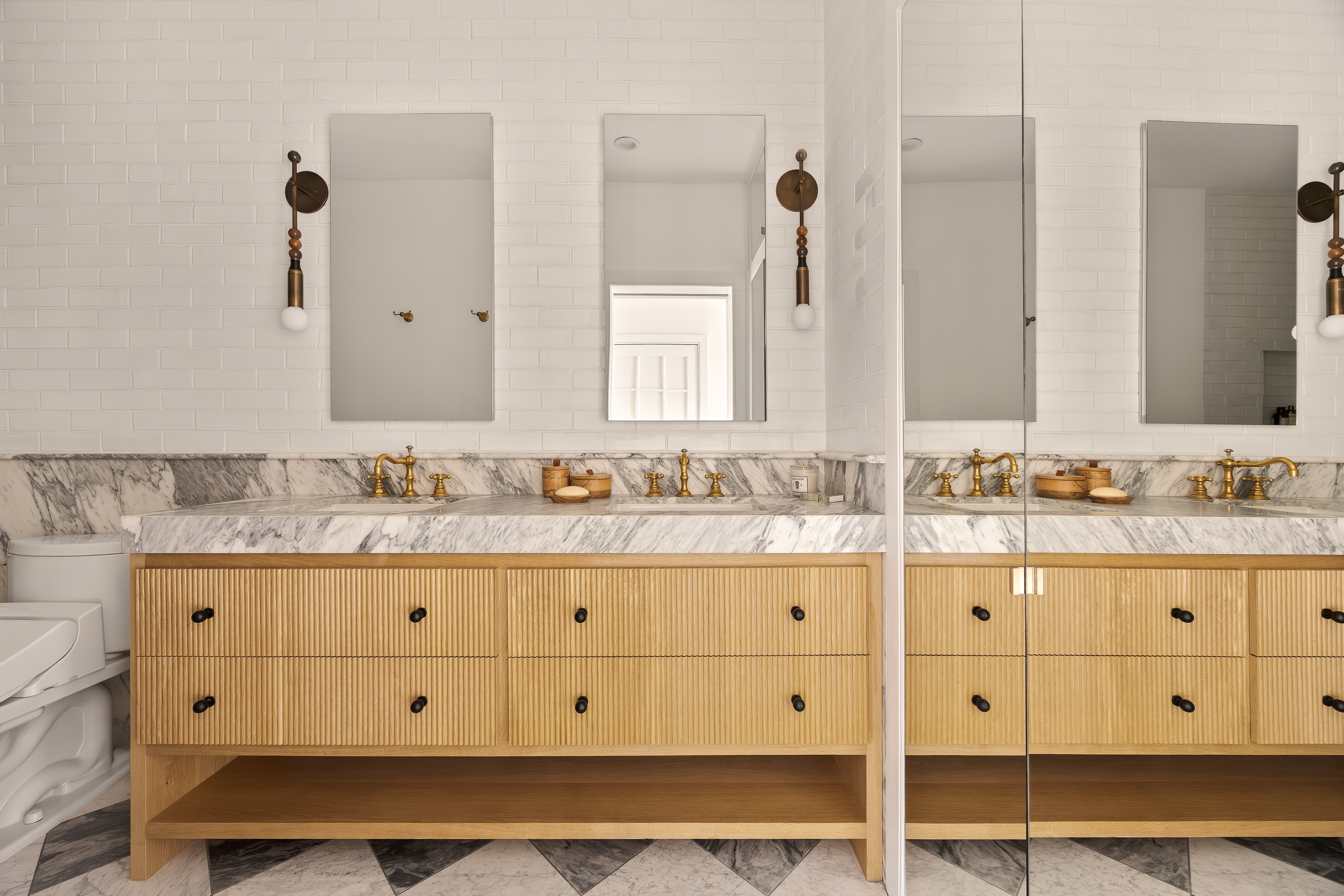 182 Lafayette Street, Unit 5 Manhattan, NY 10013 - Photo 15 of 19 a bathroom with a granite countertop double vanity sink and mirror