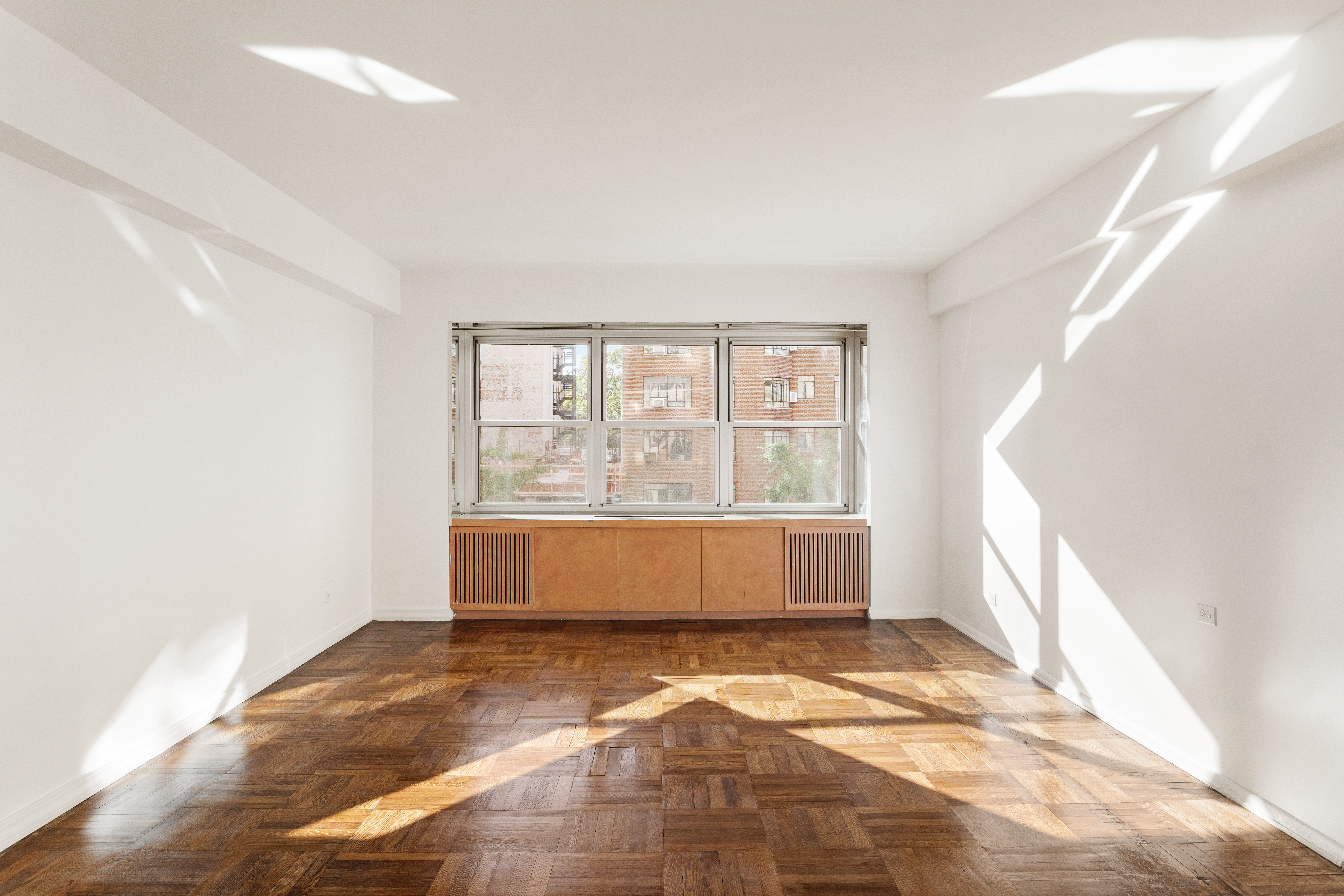 11 5th Avenue, Unit 5LW Manhattan, NY 10003 - Photo 2 of 19 a view of an empty room with a window