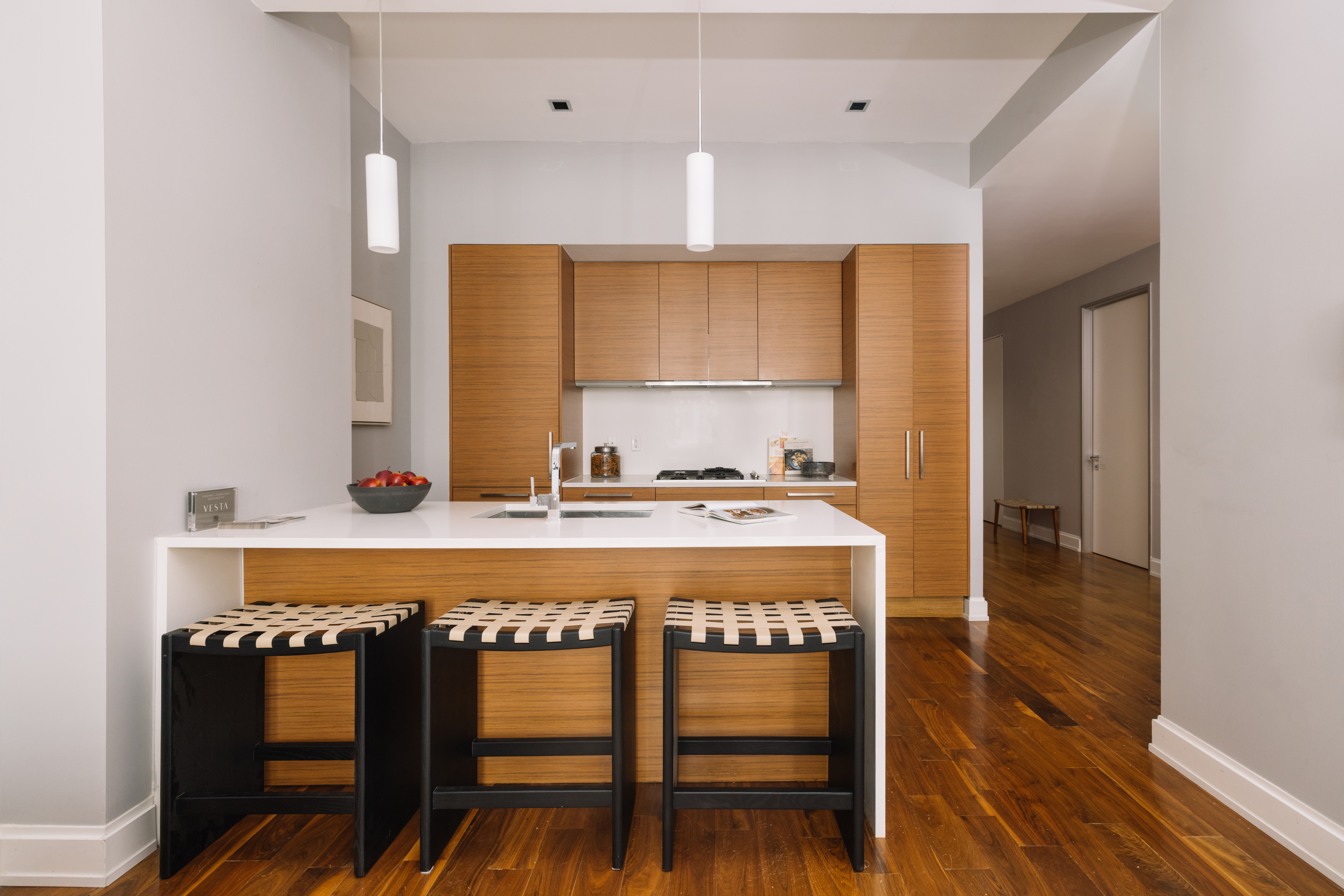 140 West 22nd Street, Unit 4C Manhattan, NY 10011 - Photo 3 of 16 a view of kitchen with cabinets and wooden floor