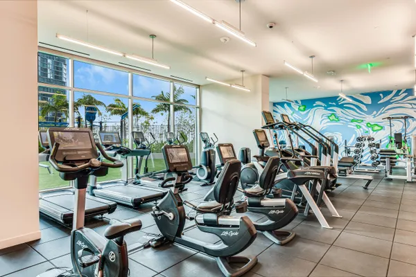 a front view of a house with a garden and plants