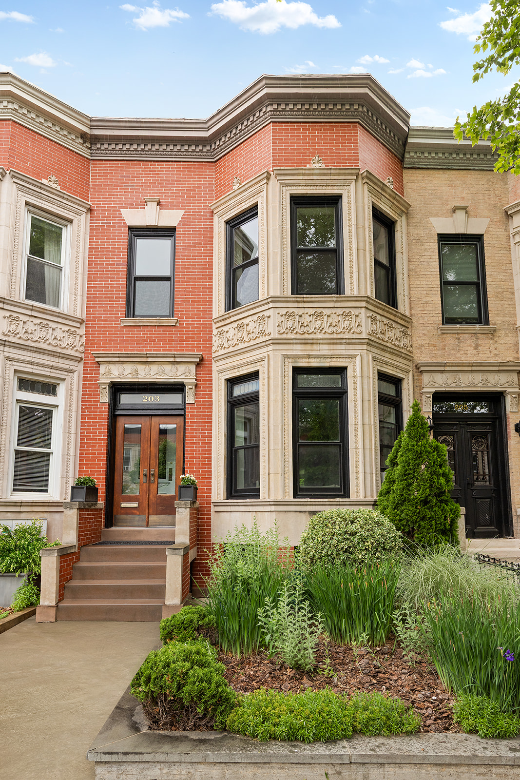 a front view of a house with garden