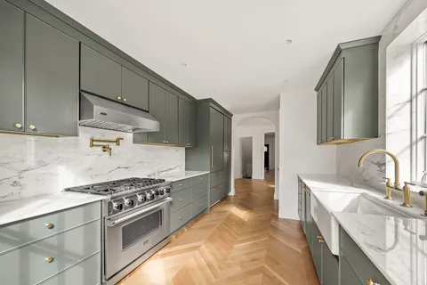 a bedroom with a bed mirror and window